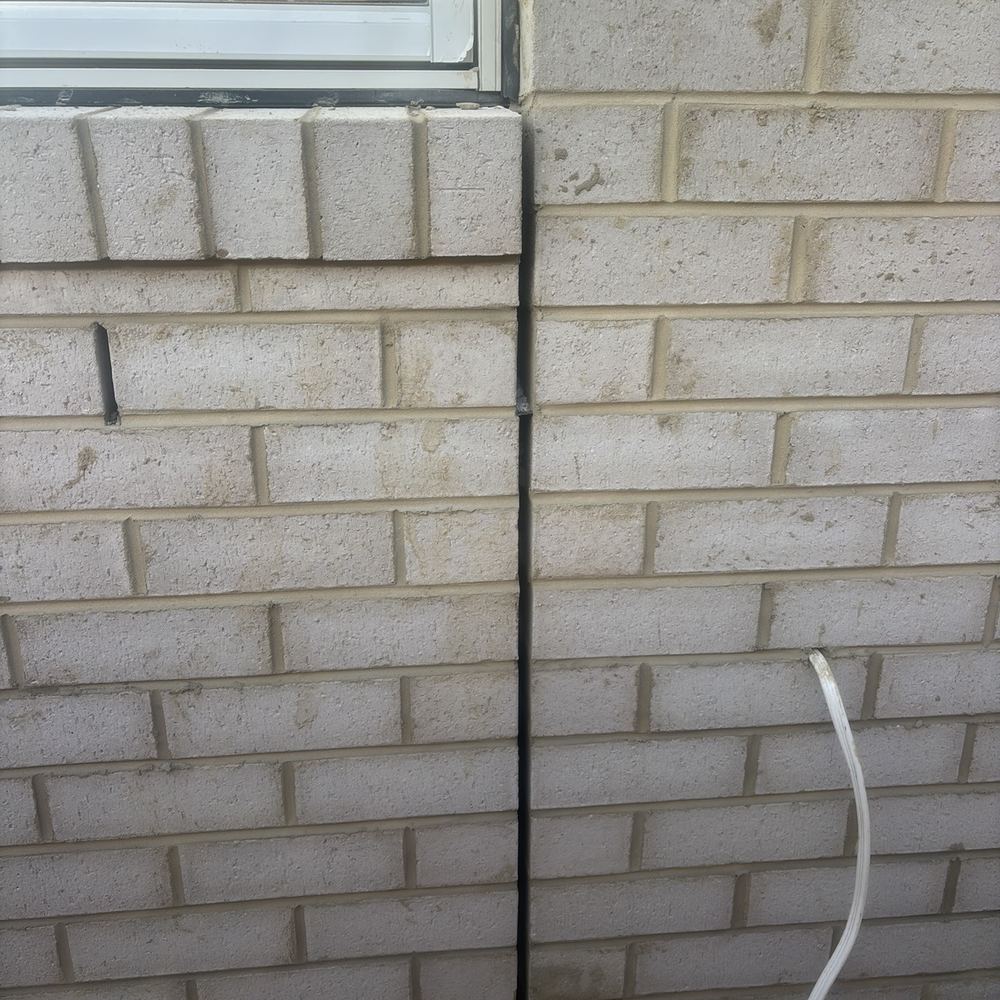 Brick expansion joint left open, needing mastic to keep water out, found during a fixing inspection in Maddingley