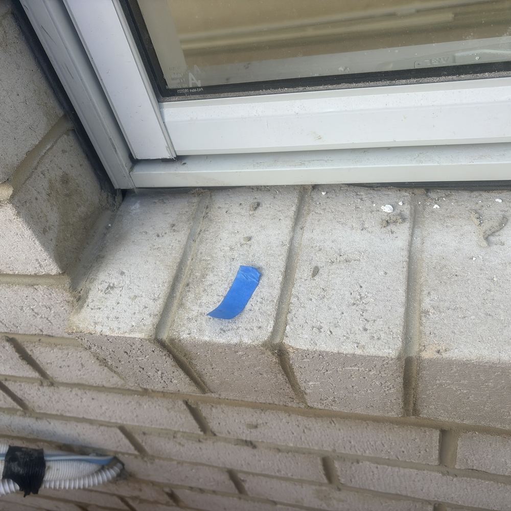 Window rubber flashing not seated between frame and cladding, found during a fixing inspection in Maddingley