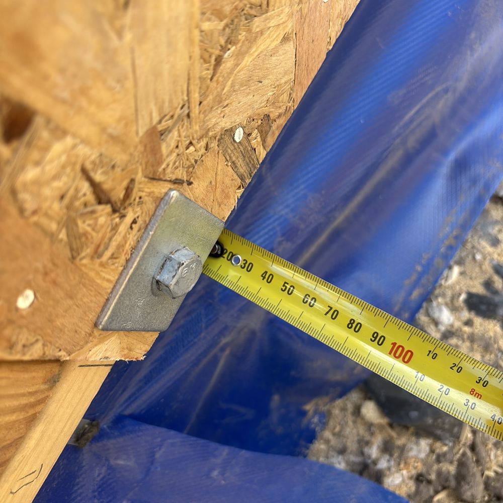 Bottom plate overhanging the slab edge by more than 10mm, found during a frame inspection in Maddingley