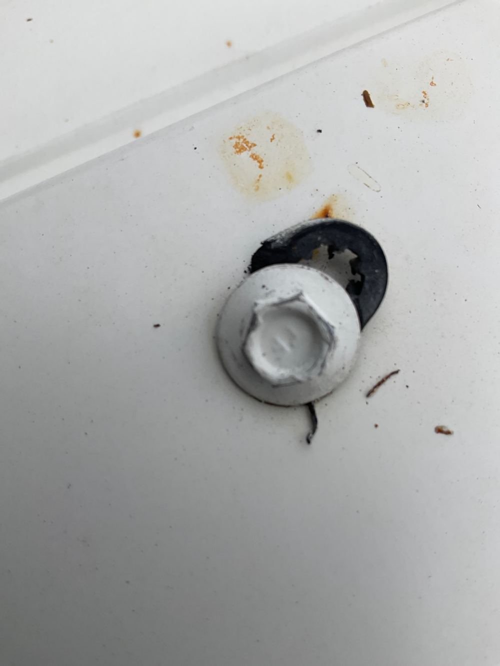 Roof screws with damaged or badly seated rubber washers, found during a pre-handover inspection in Bacchus Marsh
