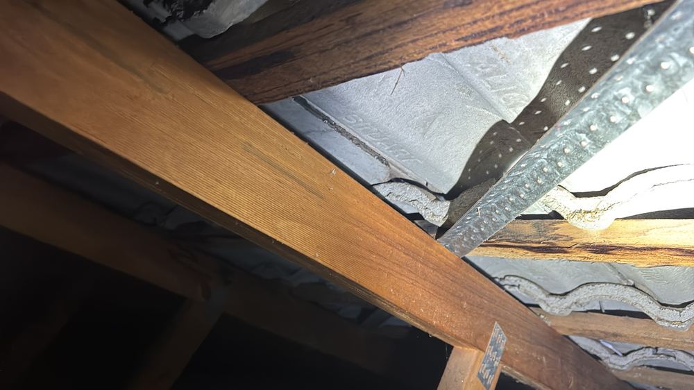 Broken roof tile that will let water into the roof space, found during a pre-purchase inspection in Darley
