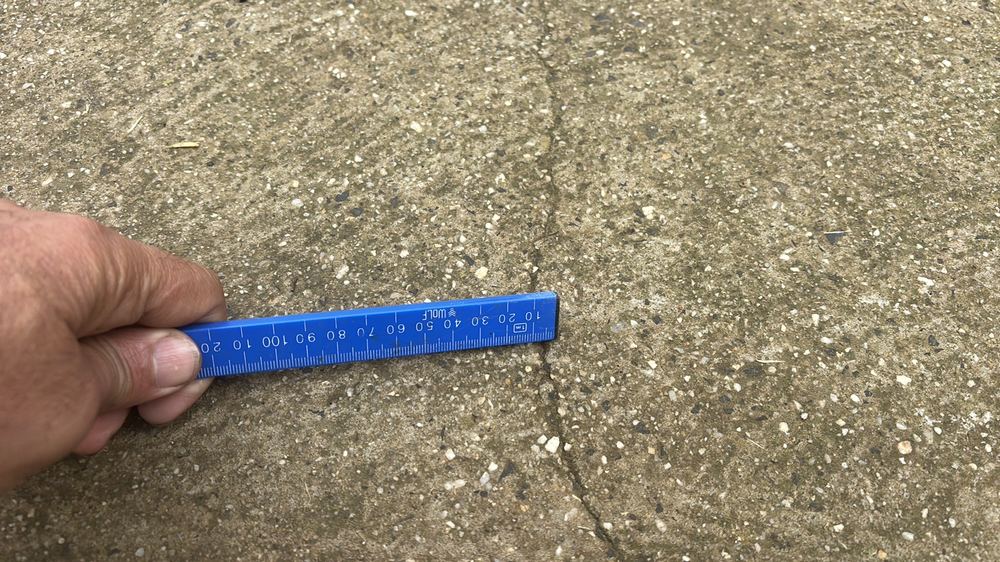 Moderate cracking from missing control joints or ground movement, found during a pre-purchase inspection in Darley