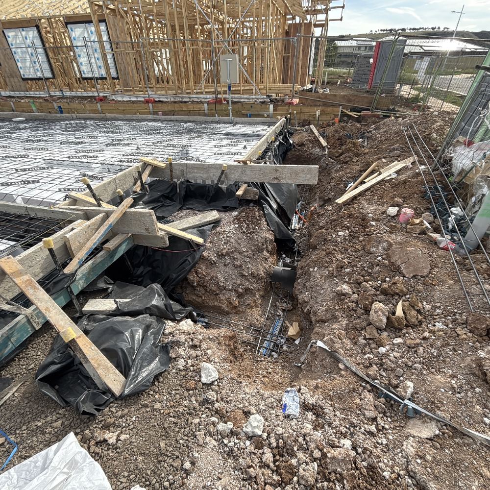 Vapour barrier stopping short of the full slab and edge beams, found during a slab inspection in Maddingley